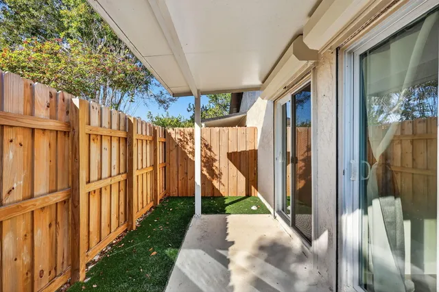 a bathroom with double vanity and a mirror
