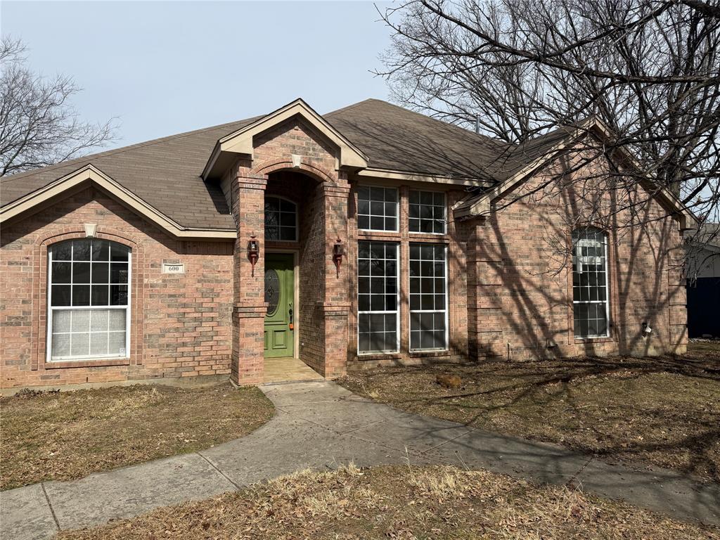 600 West Nash Street Grapevine, TX 76051 - Photo 1 of 1 a front view of a house with garden