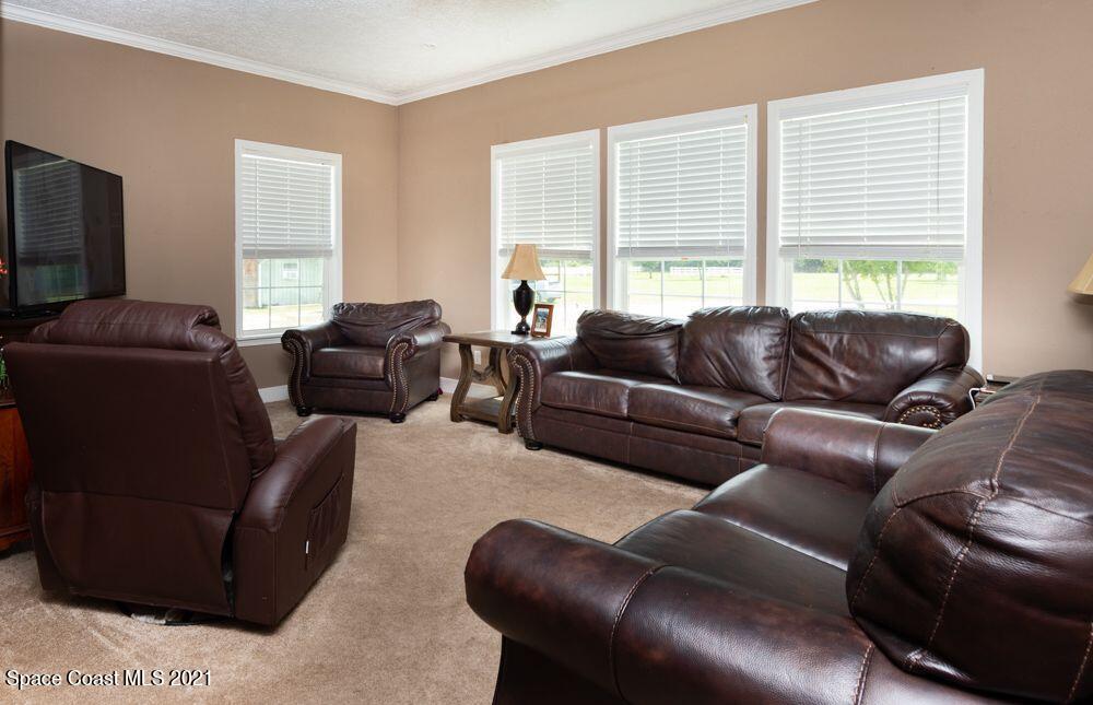 1817 Jones Road Melbourne, FL 32934 - Photo 23 of 38 a living room with furniture and a large window