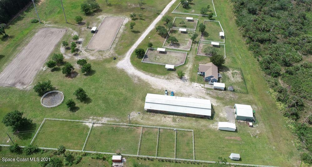1817 Jones Road Melbourne, FL 32934 - Photo 34 of 38 an aerial view of a residential houses with outdoor space