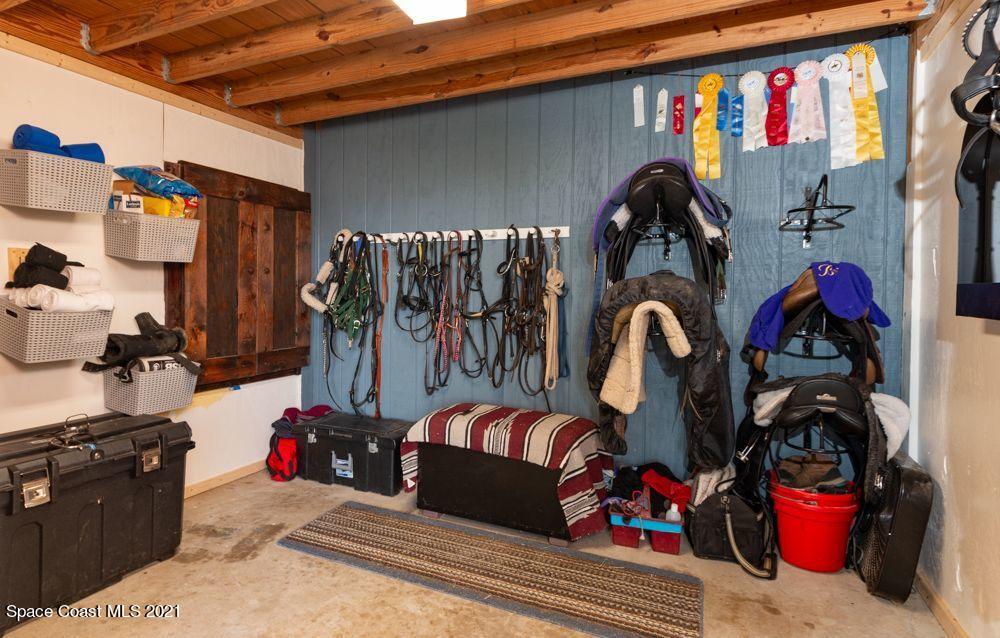 1817 Jones Road Melbourne, FL 32934 - Photo 8 of 38 a view of walk in closet with clothes and shoes