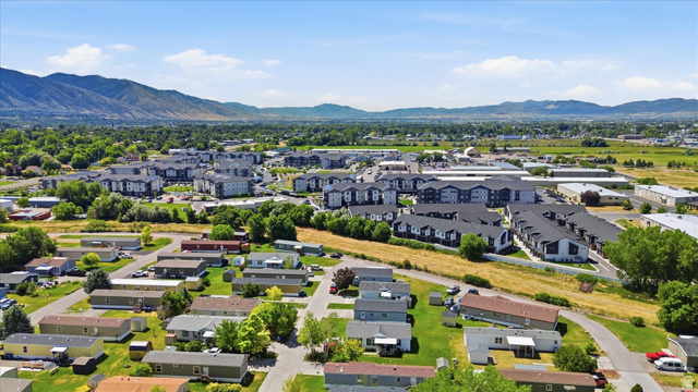 433 North 750 West Logan, UT 84321 - Photo 36 of 40 Expansive community offering a mix of residential structures, including single-story homes and multi-story buildings, surrounded by green landscaping and mature trees
