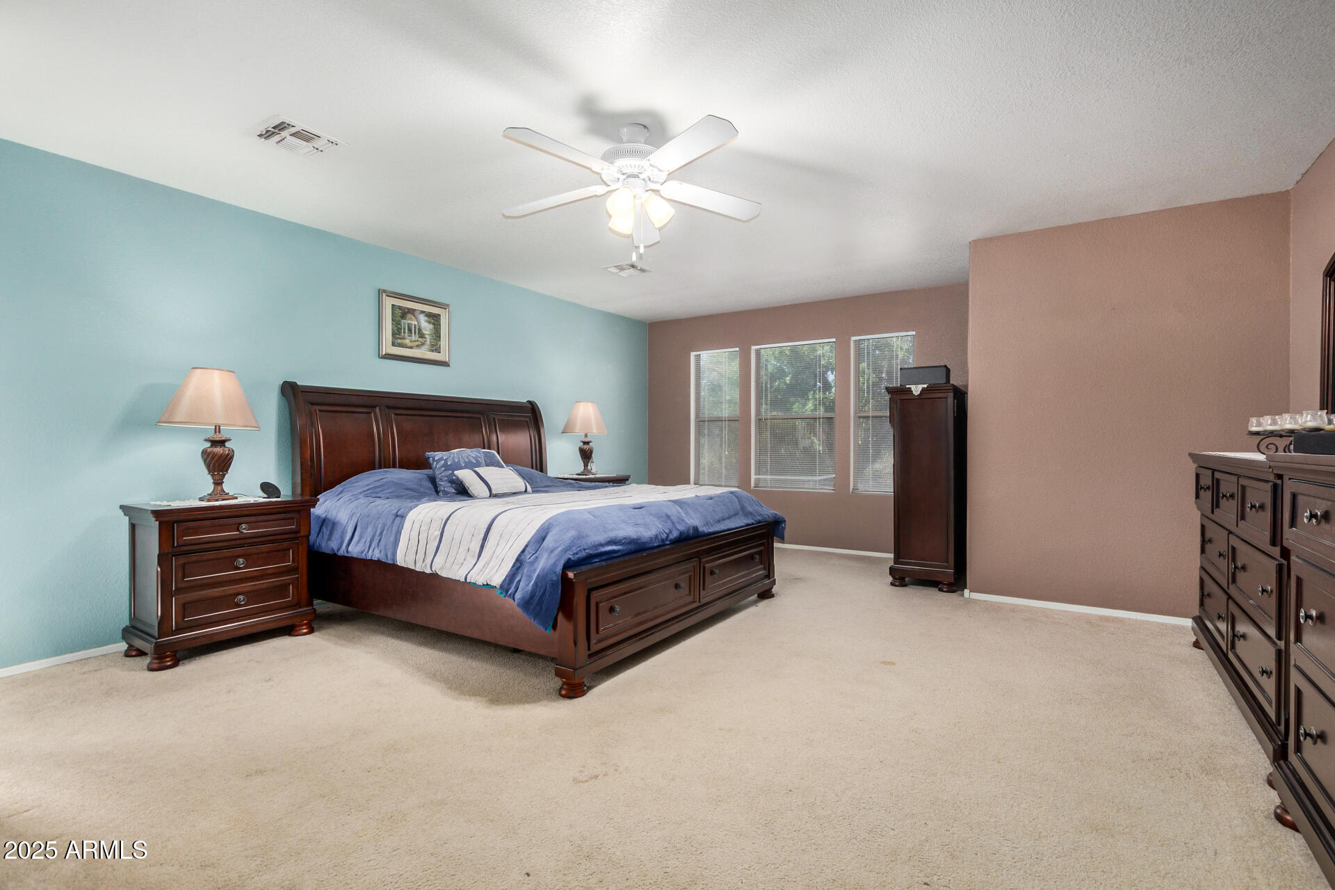 564 West Aviary Way Gilbert, AZ 85233 - Photo 12 of 29 a bedroom with a large bed and a chandelier