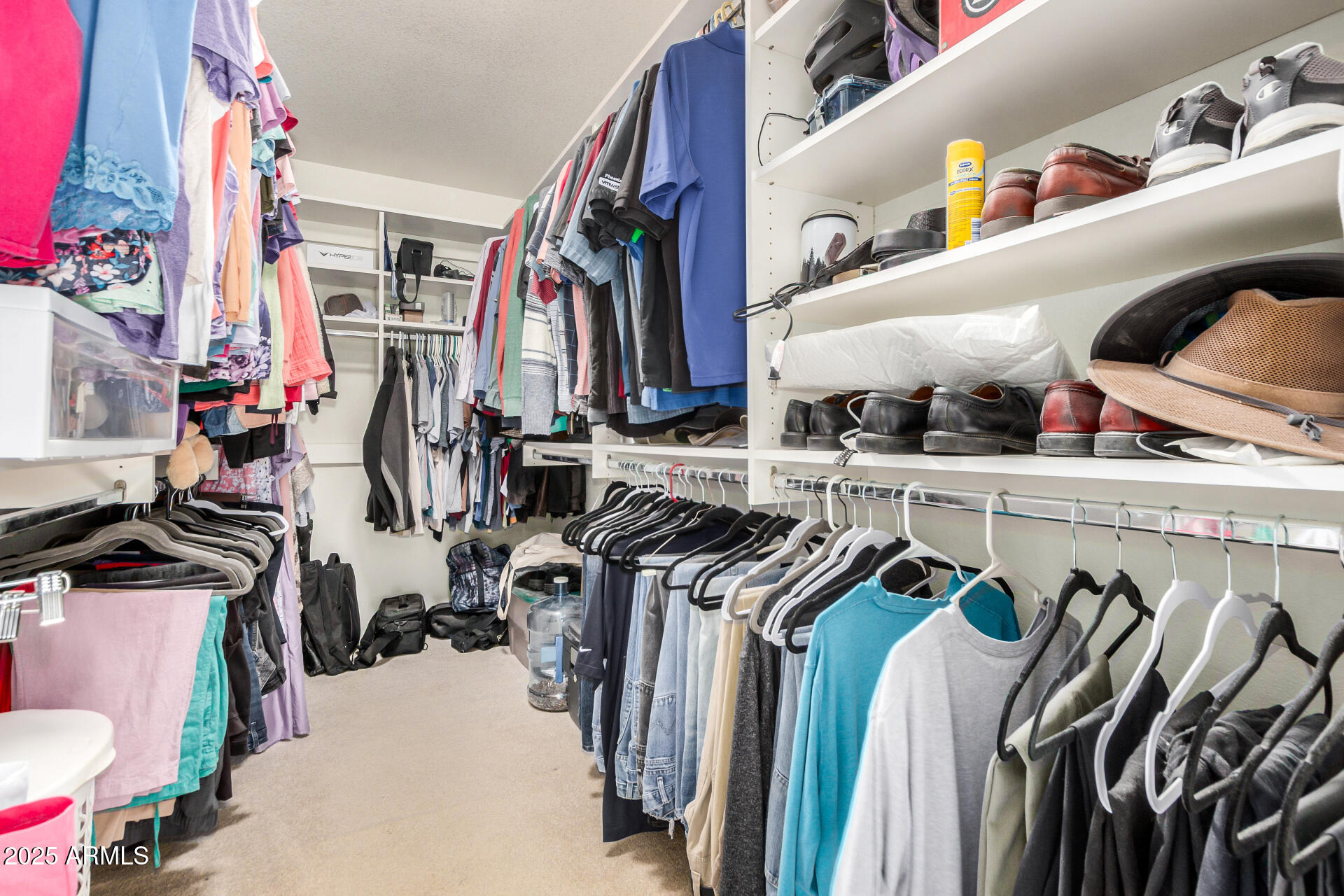 564 West Aviary Way Gilbert, AZ 85233 - Photo 13 of 29 a view of walk in closet with clothes