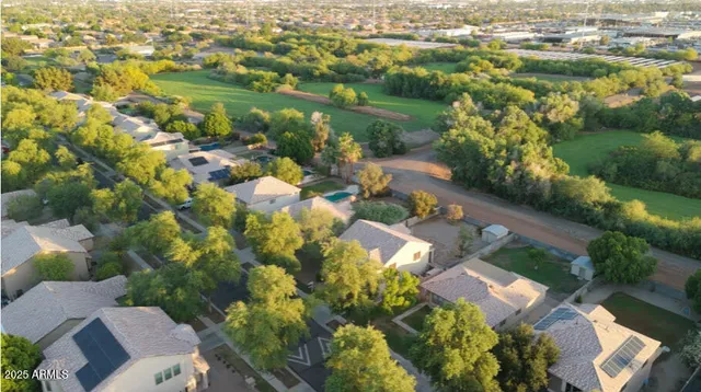 an aerial view of residential houses with outdoor space