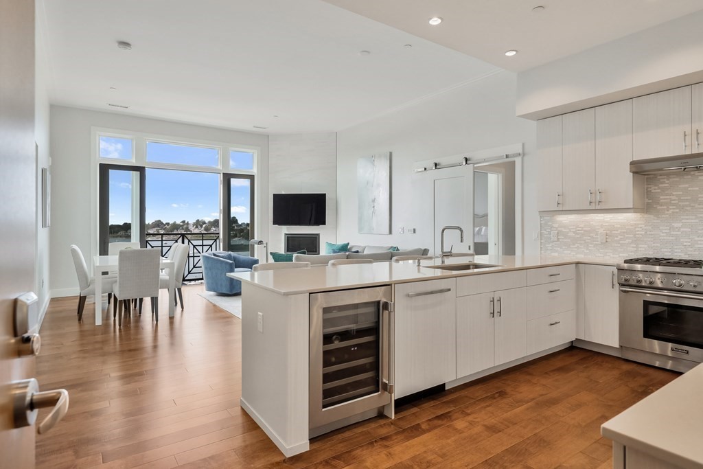 10 Shipyard Drive, Unit 510 Hingham, MA 02043 - Photo 1 of 40 a kitchen with sink stove and cabinets