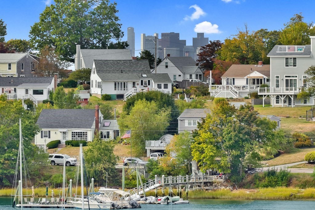 10 Shipyard Drive, Unit 510 Hingham, MA 02043 - Photo 11 of 40 a front view of a residential apartment building with a yard and large trees