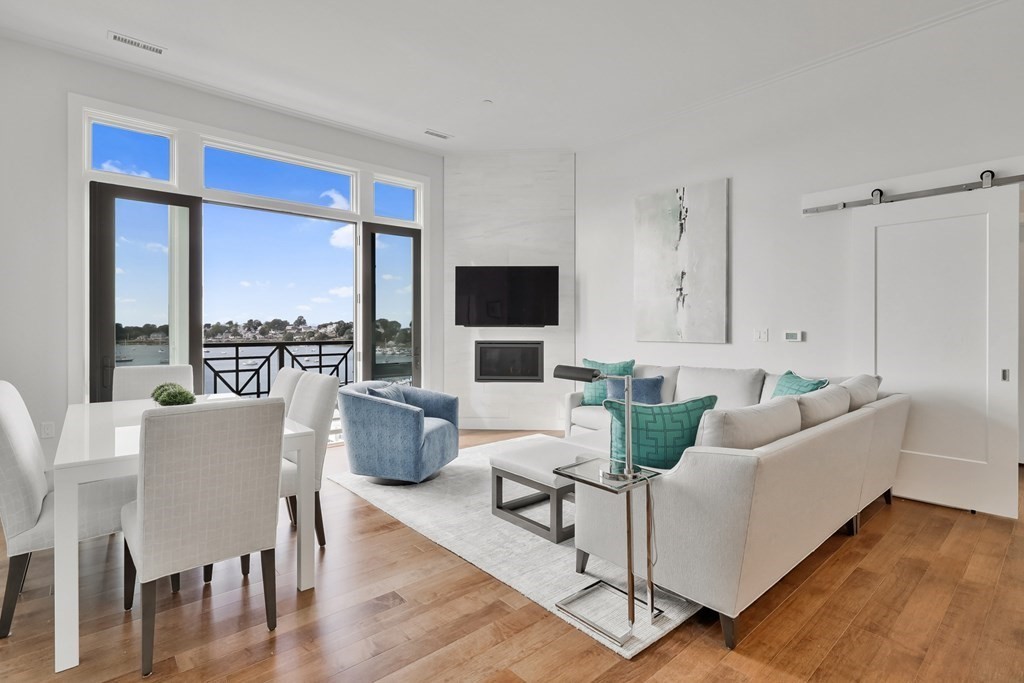 10 Shipyard Drive, Unit 510 Hingham, MA 02043 - Photo 2 of 40 a living room with furniture and a flat screen tv