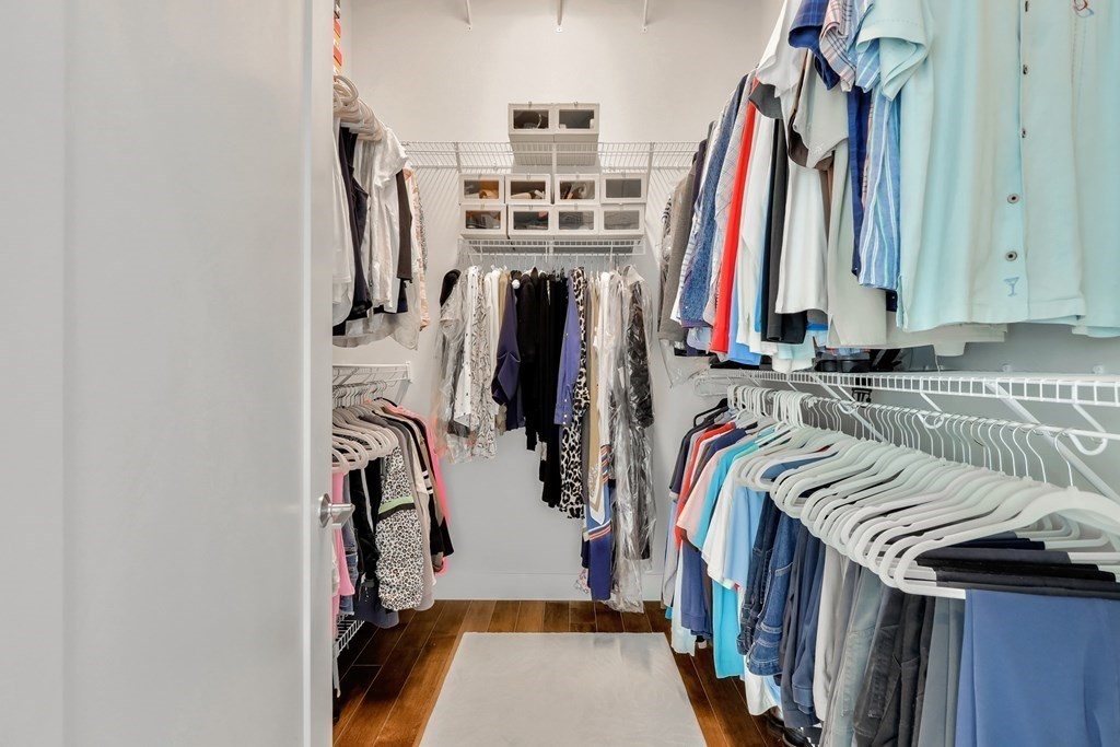 10 Shipyard Drive, Unit 510 Hingham, MA 02043 - Photo 28 of 40 a view of walk in closet with clothes and shoes