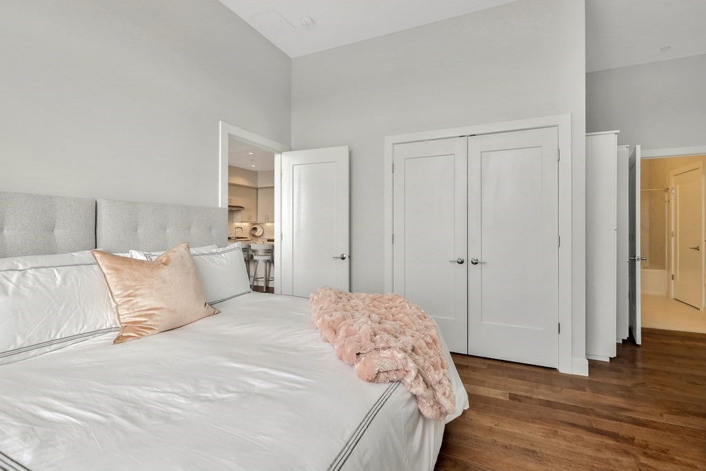 10 Shipyard Drive, Unit 510 Hingham, MA 02043 - Photo 31 of 40 a bedroom with a bed and a walk in closet