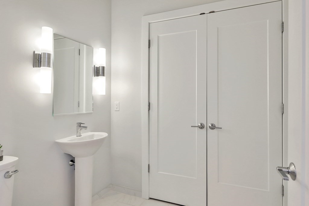 10 Shipyard Drive, Unit 510 Hingham, MA 02043 - Photo 34 of 40 a bathroom with a sink a mirror and a shower