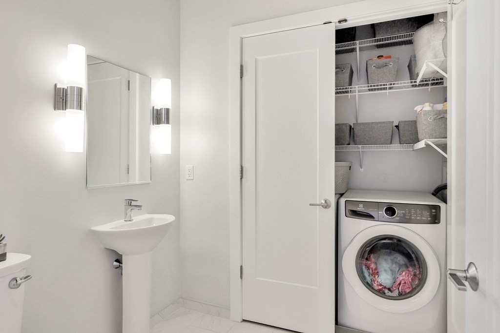 10 Shipyard Drive, Unit 510 Hingham, MA 02043 - Photo 35 of 40 a utility room with sink dryer and washer