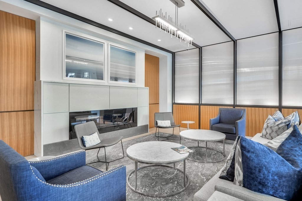 10 Shipyard Drive, Unit 510 Hingham, MA 02043 - Photo 37 of 40 a living room with furniture and a fireplace