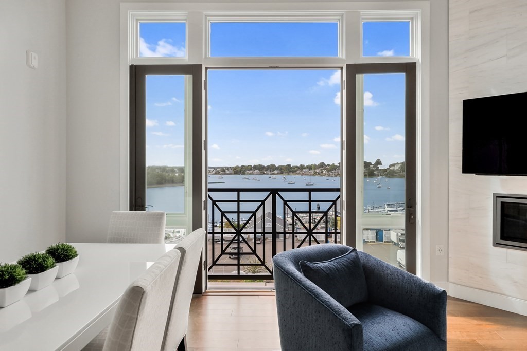 10 Shipyard Drive, Unit 510 Hingham, MA 02043 - Photo 5 of 40 a living room with furniture tv and a large window