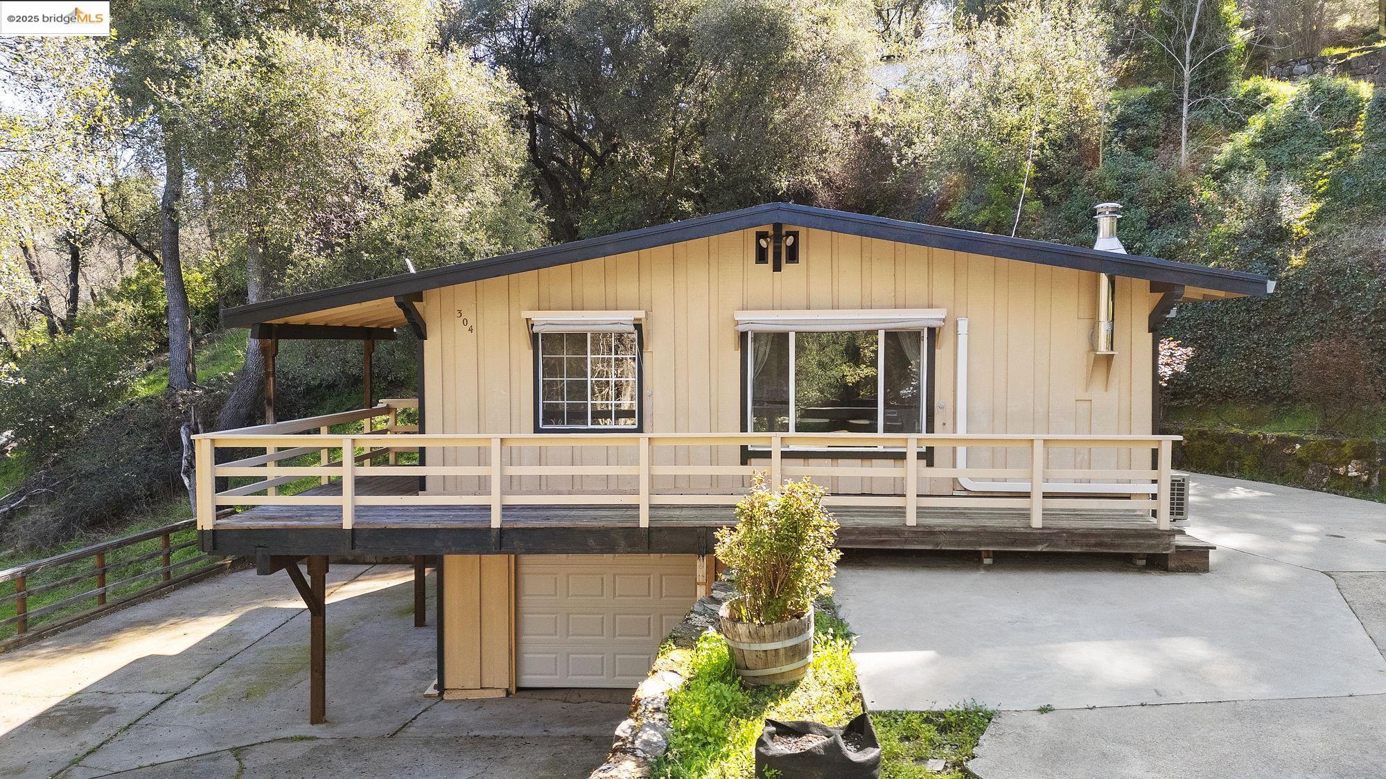 304 Gerrymander Avenue Sonora, CA 95370 - Photo 1 of 1 a view of house with swimming pool and sitting area
