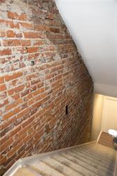 344 Bushkill Street, Unit 2 Easton, PA 18042 - Photo 6 of 30 Exposed brick accents this unique interior staircase.