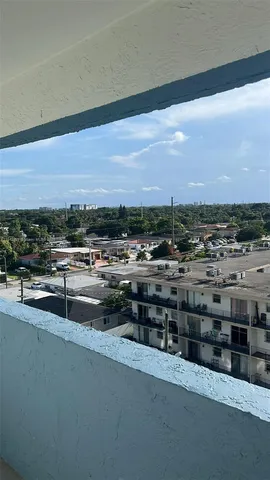 a wooden bench sitting in the backyard of a house