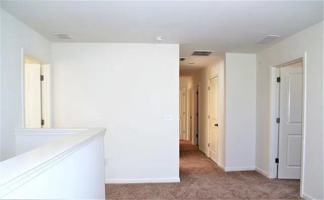 a view of a hallway with closet