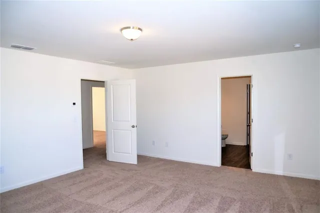 a bathroom with a sink vanity and a toilet