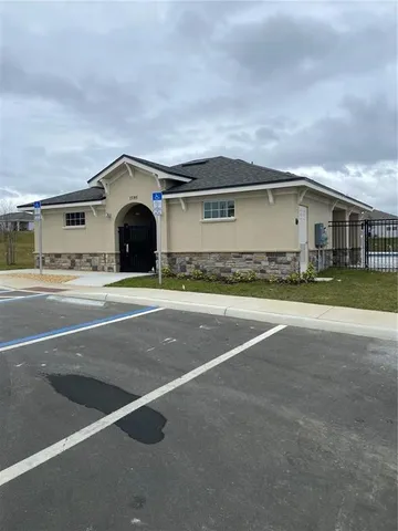 a view of a lake with houses in the back