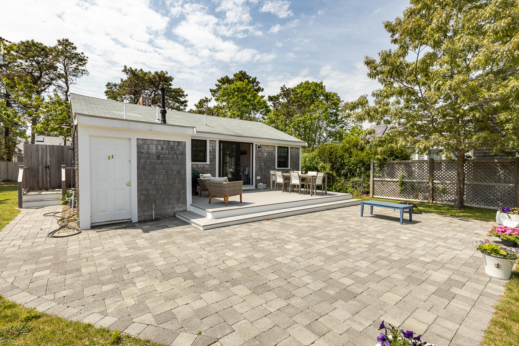 16 Edwards Road Dennis Port, MA 02639 - Photo 11 of 46 a view of a outdoor space with a patio and a garden