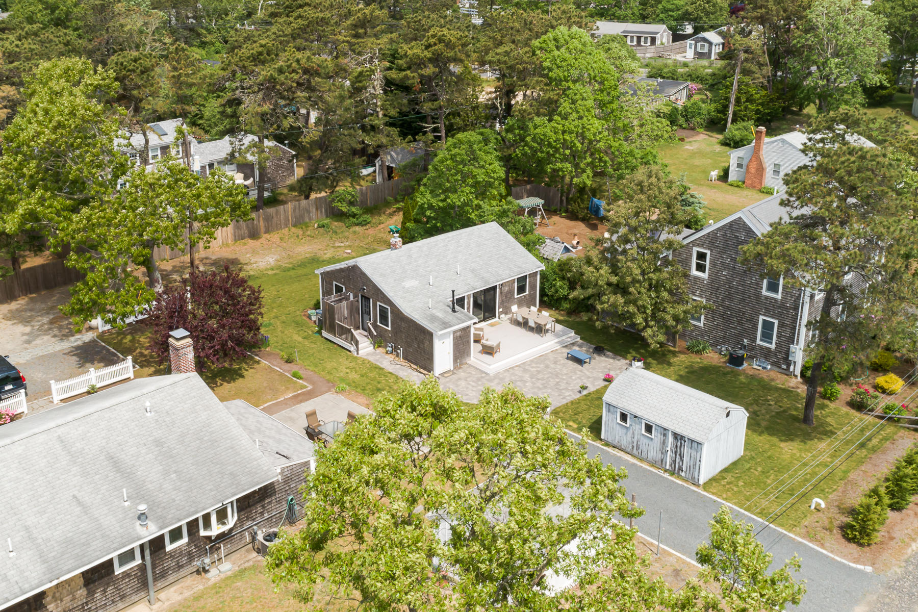 16 Edwards Road Dennis Port, MA 02639 - Photo 15 of 46 an aerial view of residential house with outdoor space and trees all around