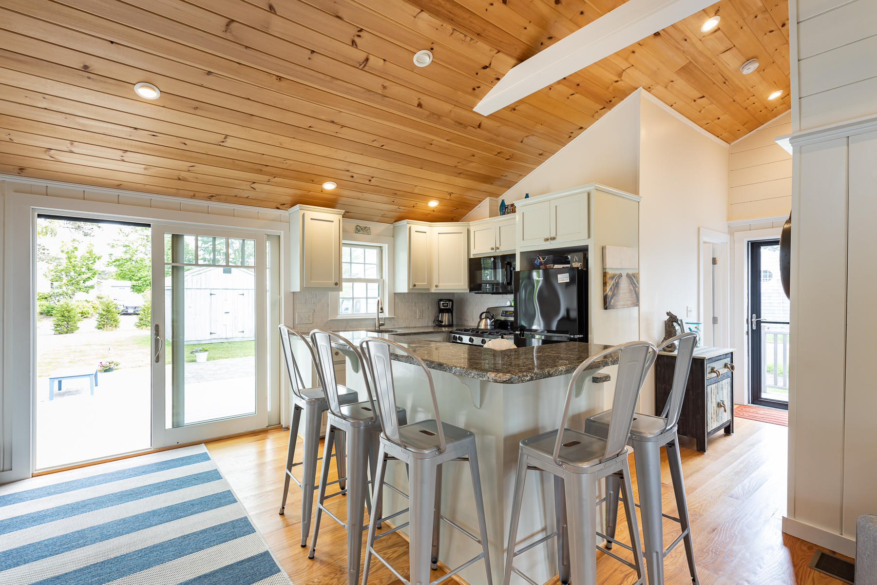 16 Edwards Road Dennis Port, MA 02639 - Photo 19 of 46 a view of a dining room with furniture window and wooden floor