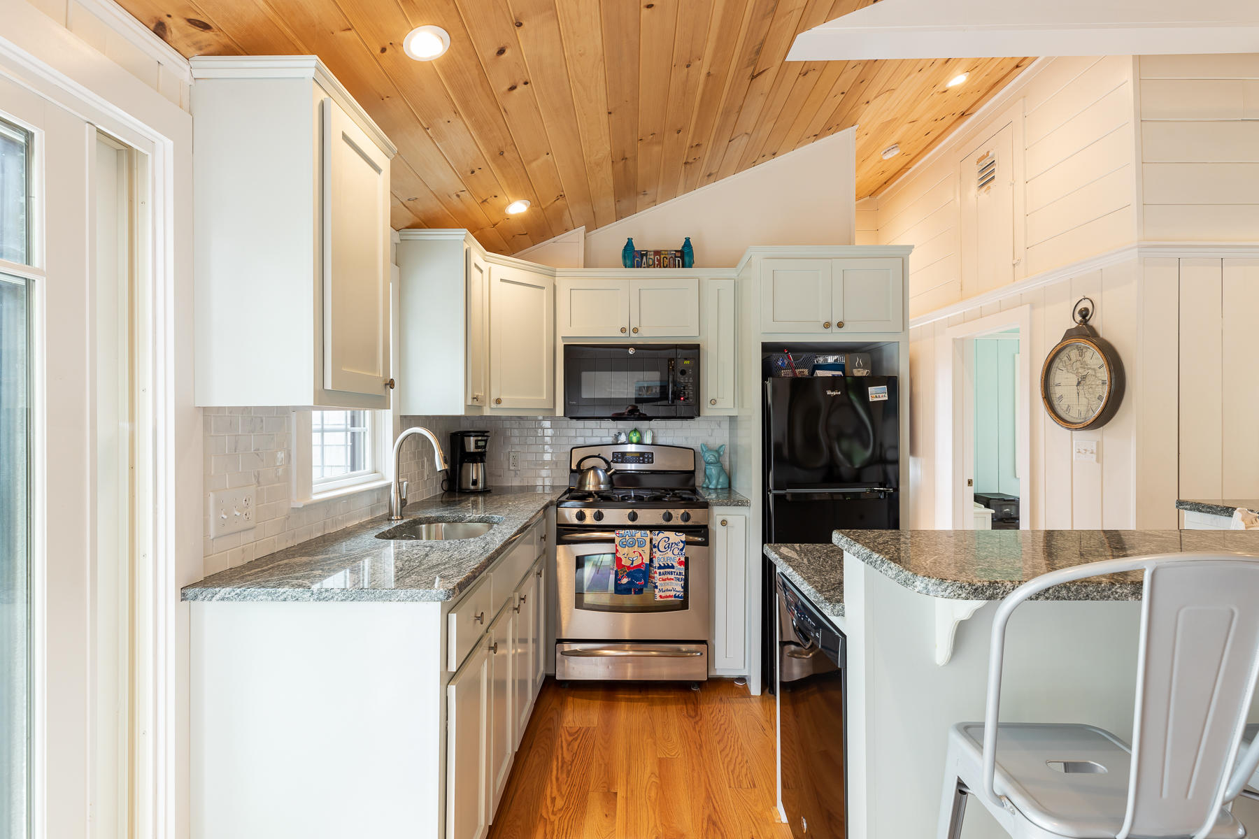 16 Edwards Road Dennis Port, MA 02639 - Photo 23 of 46 a kitchen with granite countertop a refrigerator a stove top oven a sink and dishwasher