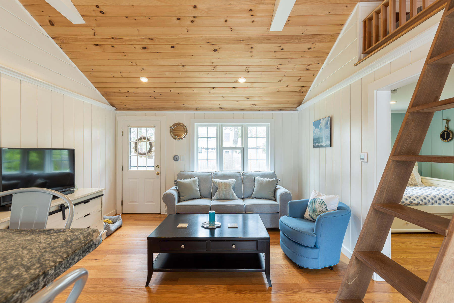 16 Edwards Road Dennis Port, MA 02639 - Photo 24 of 46 a living room with furniture and a flat screen tv