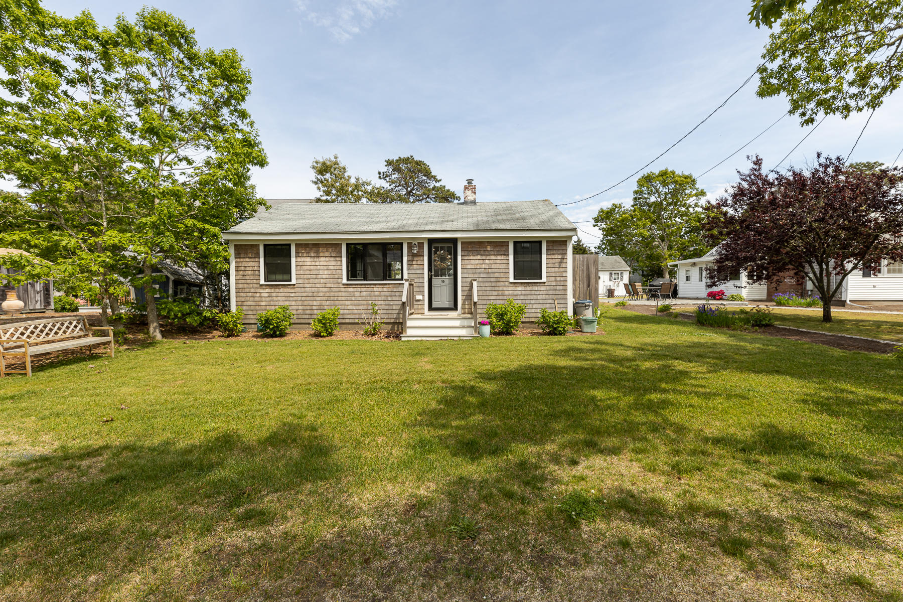 16 Edwards Road Dennis Port, MA 02639 - Photo 3 of 46 a front view of house with yard and green space