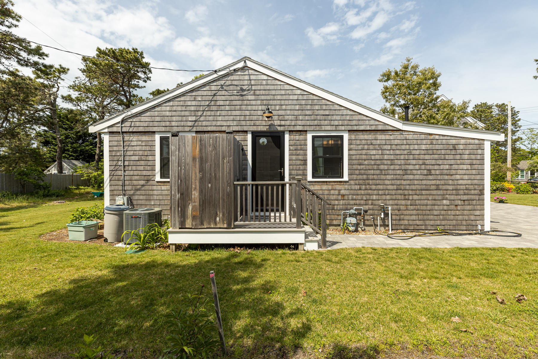 16 Edwards Road Dennis Port, MA 02639 - Photo 4 of 46 a front view of a house with a yard