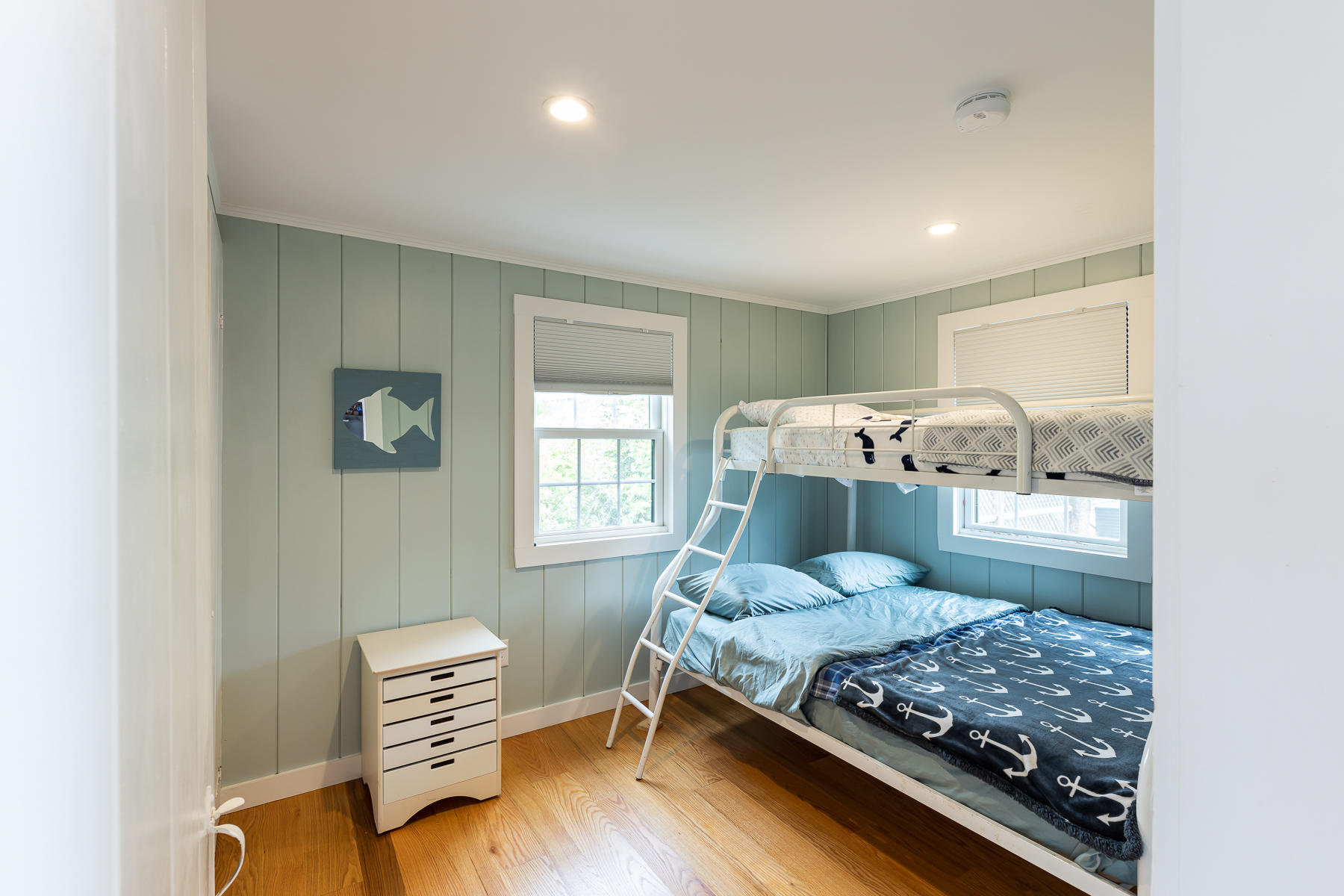 16 Edwards Road Dennis Port, MA 02639 - Photo 41 of 46 a bedroom with a bed and wooden floor