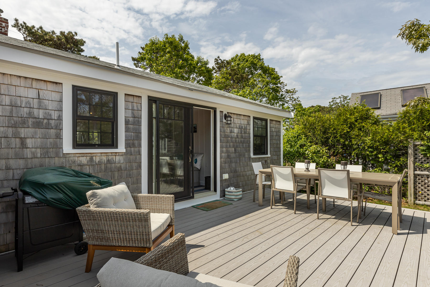 16 Edwards Road Dennis Port, MA 02639 - Photo 7 of 46 a balcony with furniture and wooden floor