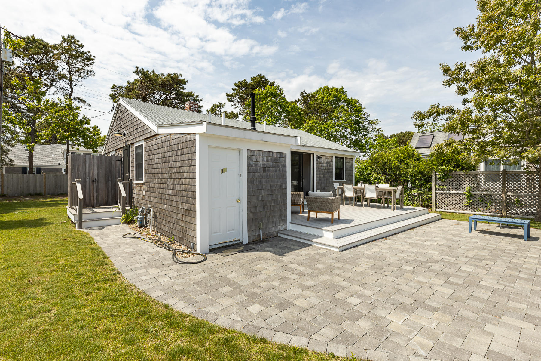 16 Edwards Road Dennis Port, MA 02639 - Photo 10 of 46 a view of a house with backyard and sitting area