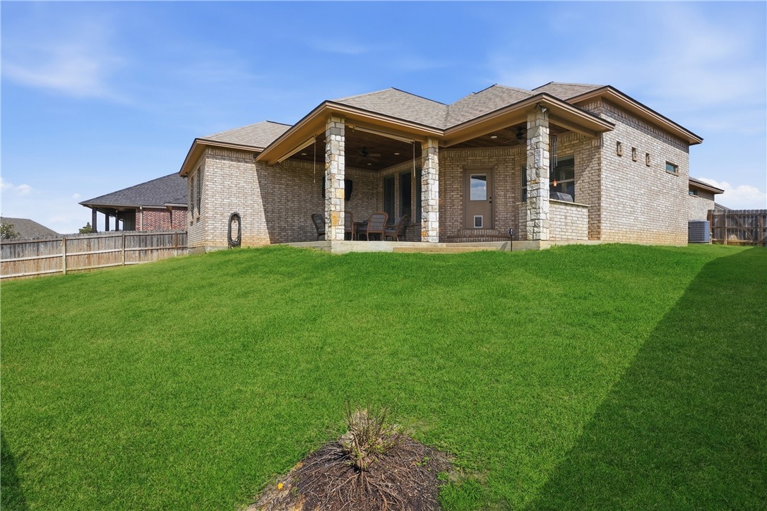 3516 Foxcroft Path Bryan, TX 77808 - Photo 35 of 38 a view of a house with a big yard and large trees