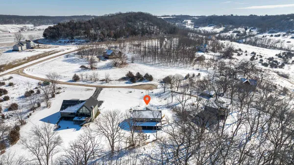 a bedroom with a bed and a tv on table