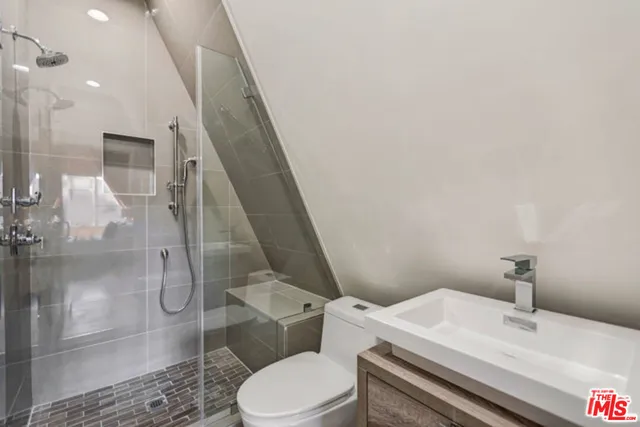 a bedroom with a bed and a couch