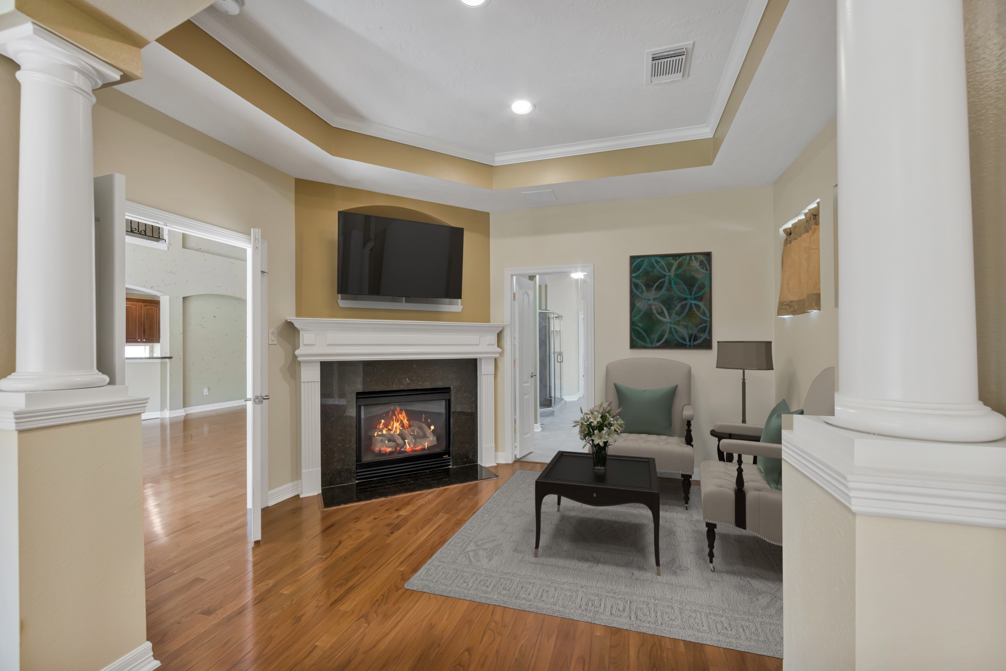 10410 Kilbride Way Court Spring, TX 77379 - Photo 17 of 49 *Virtually Staged* The sitting area of the primary suite with another gas fireplace and beautiful ceiling.