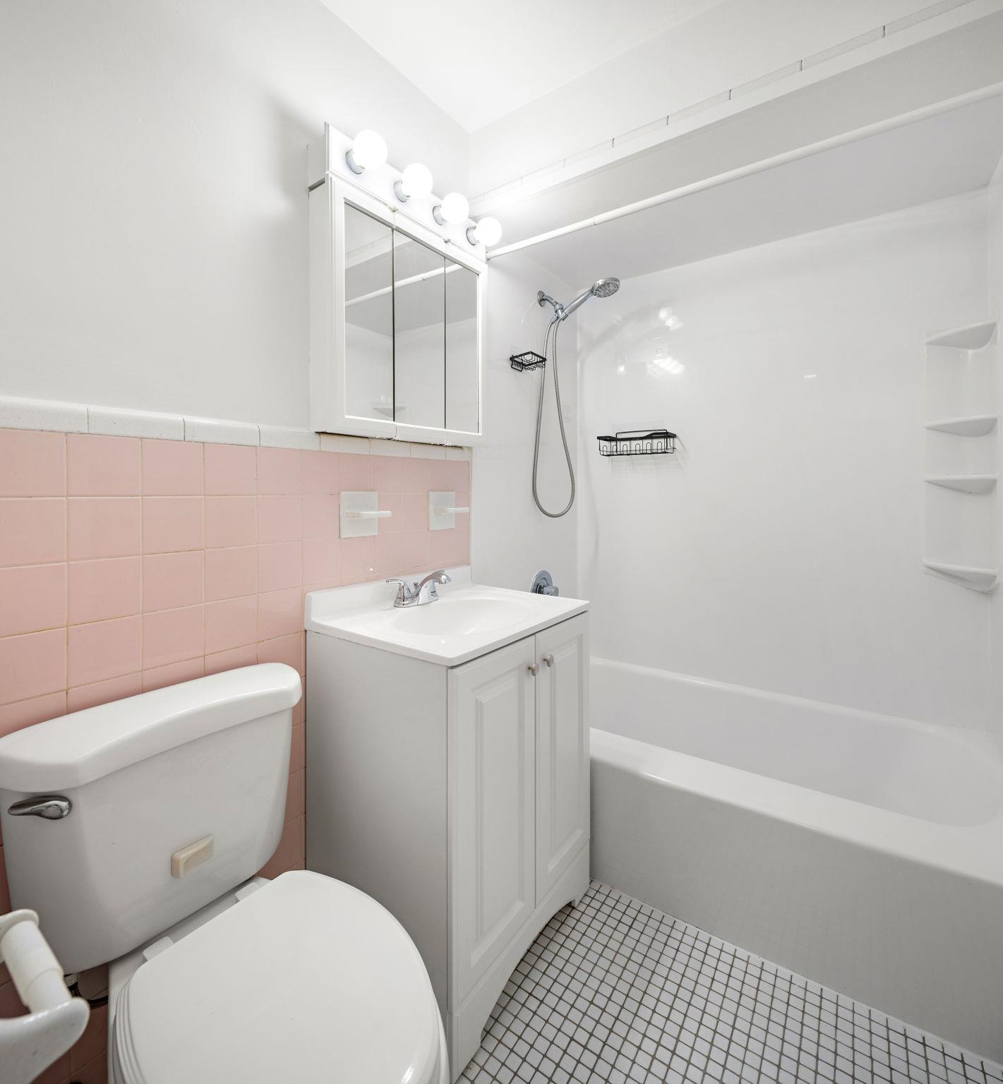 70 2nd Avenue, Unit 2 Secaucus, NJ 07094 - Photo 14 of 14 a bathroom with a sink a toilet and shower