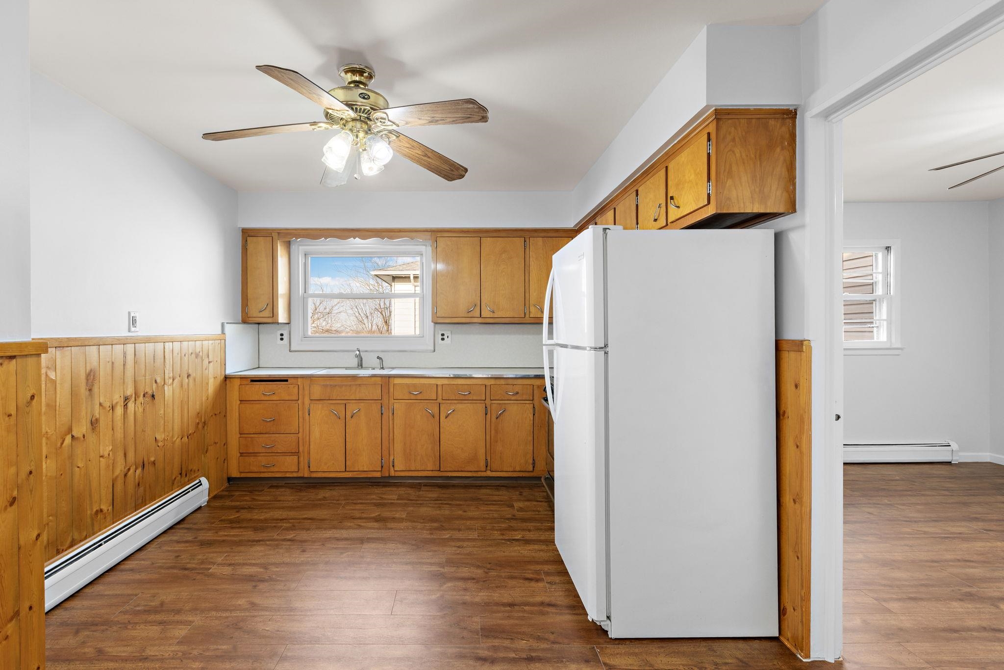 70 2nd Avenue, Unit 2 Secaucus, NJ 07094 - Photo 6 of 14 a kitchen with granite countertop a refrigerator a sink and dishwasher