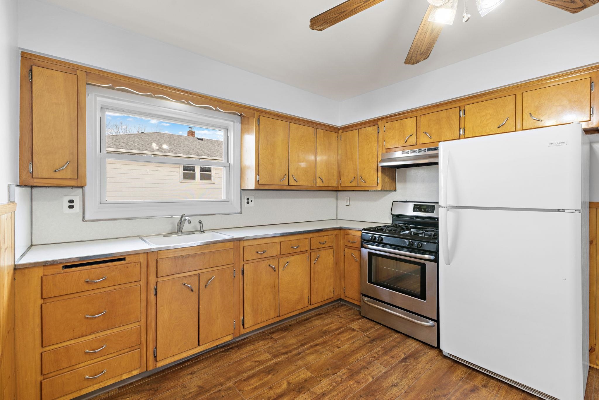70 2nd Avenue, Unit 2 Secaucus, NJ 07094 - Photo 7 of 14 a kitchen with granite countertop appliances a sink cabinets and a window