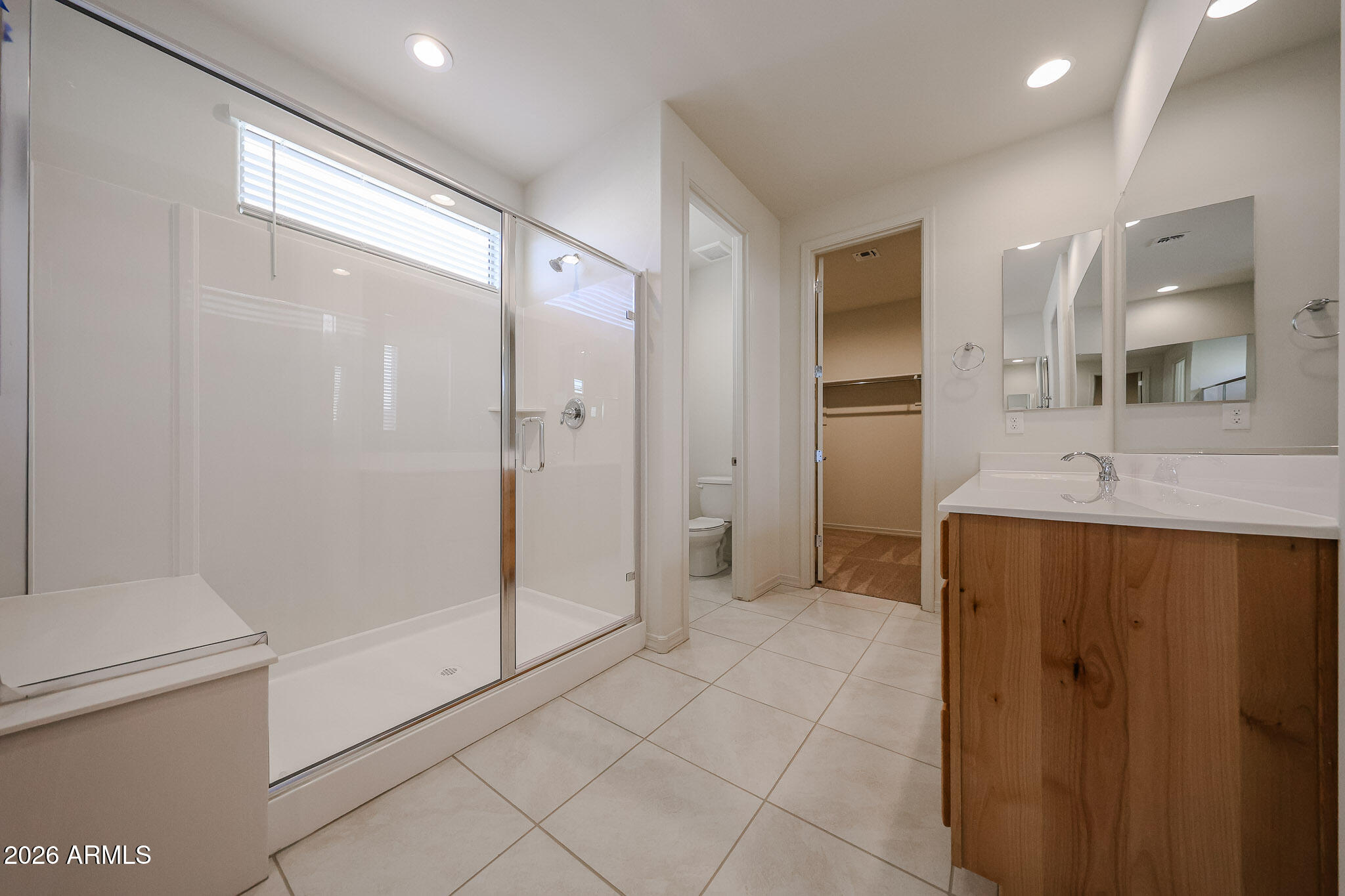 7023 West Plum Road Peoria, AZ 85383 - Photo 11 of 22 a bathroom with a shower and a sink