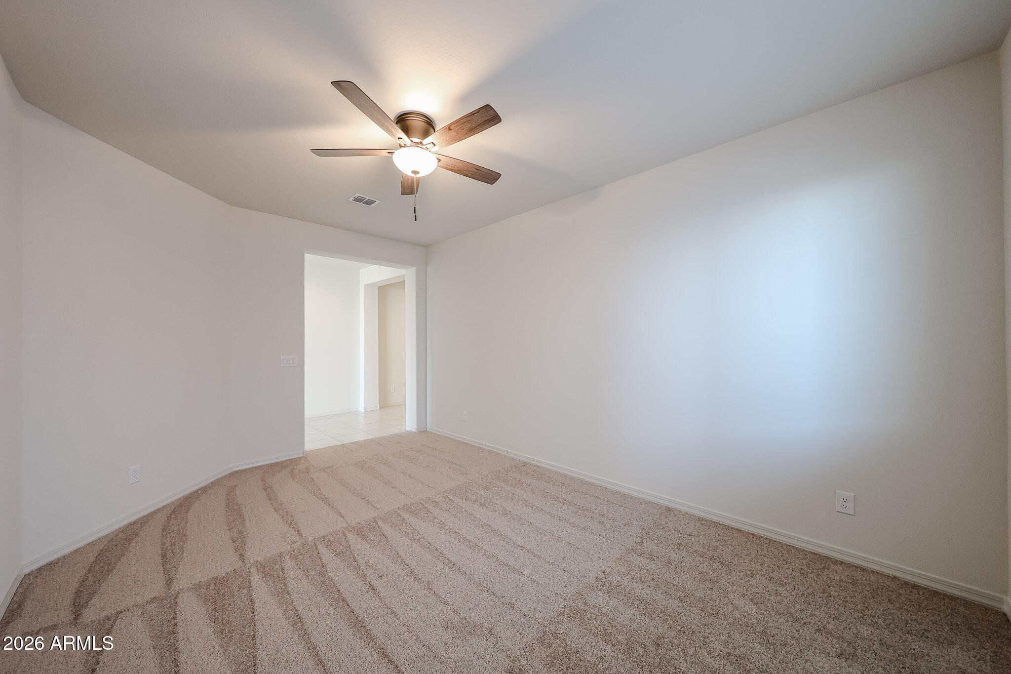 7023 West Plum Road Peoria, AZ 85383 - Photo 18 of 22 a view of an empty room with a window