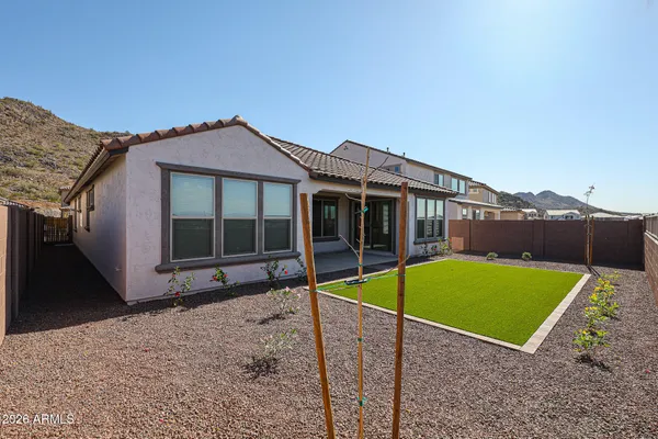 a view of a house with a backyard