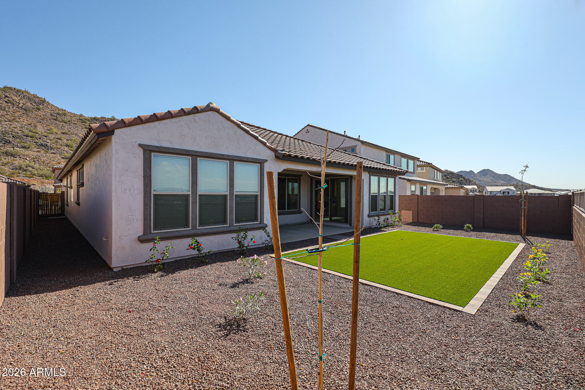 7023 West Plum Road Peoria, AZ 85383 - Photo 20 of 22 a view of a house with a backyard