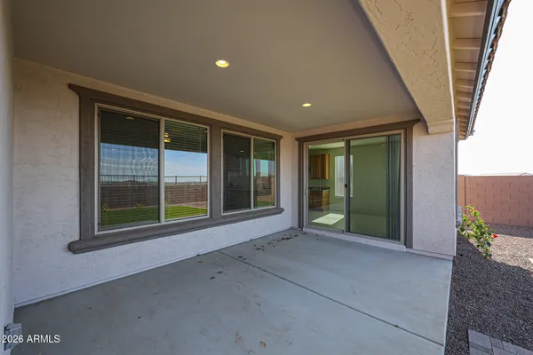 a view of an empty room with a sliding door