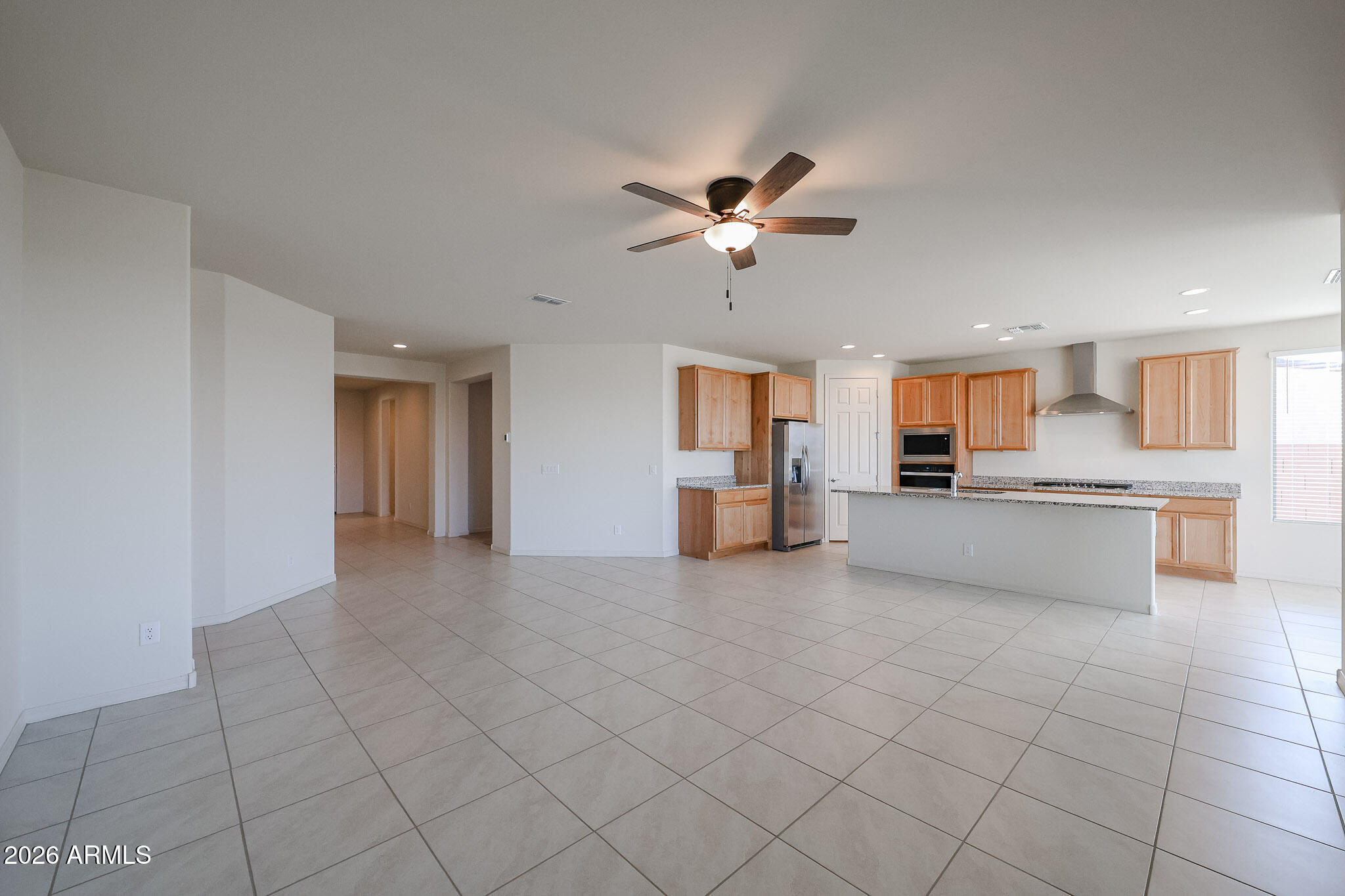 7023 West Plum Road Peoria, AZ 85383 - Photo 6 of 22 a view of a kitchen with furniture and a kitchen view