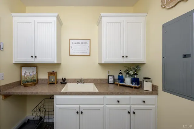 a bathroom with a double vanity sink mirror and shower
