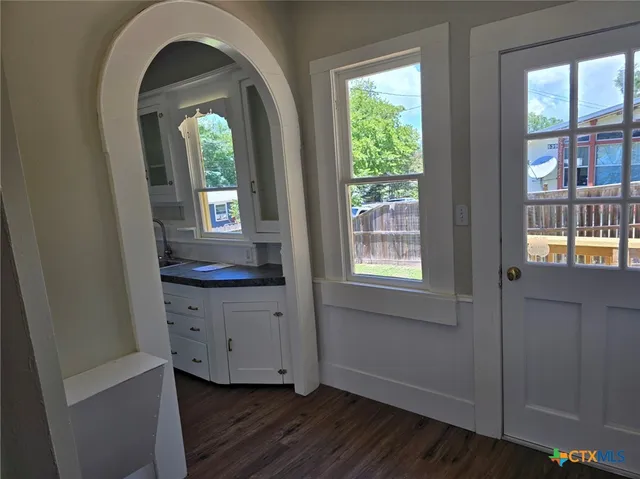 a view of a sink and dishwasher in a kitchen
