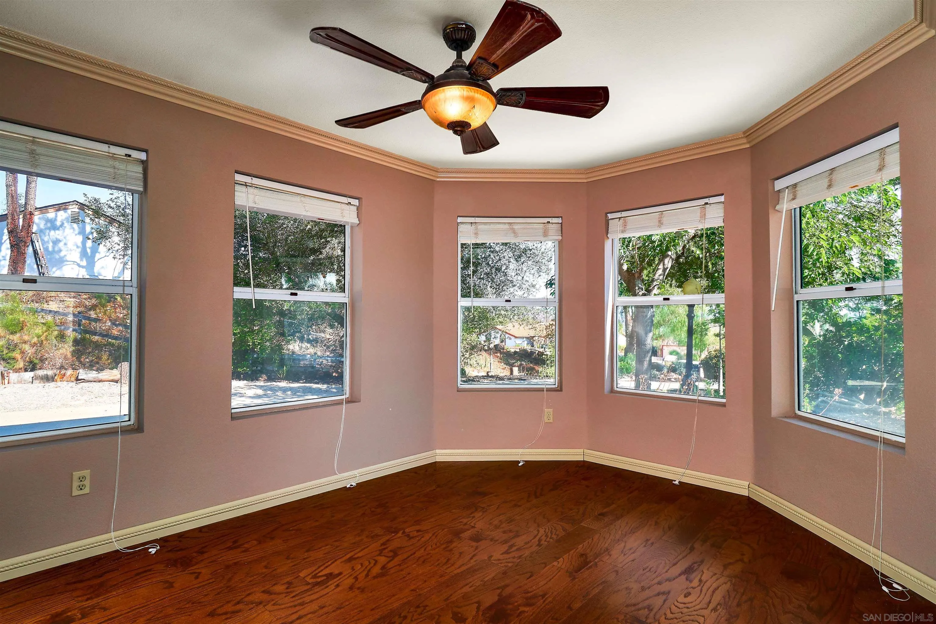 24314 Rutherford Road Ramona, CA 92065 - Photo 8 of 26 a view of an empty room with wooden floor and a window